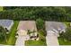 Single-story house with a two-car garage and palm trees at 16984 Se 109Th Ave, Summerfield, FL 34491