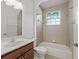 Clean bathroom with a tub, toilet, and vanity at 16984 Se 109Th Ave, Summerfield, FL 34491