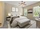 Bright bedroom featuring a king-size bed and stylish decor at 16984 Se 109Th Ave, Summerfield, FL 34491