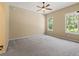 Spacious bedroom with ceiling fan and large windows at 16984 Se 109Th Ave, Summerfield, FL 34491