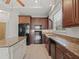 Modern kitchen featuring granite countertops and stainless steel appliances at 16984 Se 109Th Ave, Summerfield, FL 34491