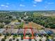 Aerial view of a home highlighting its location near lush greenery and community amenities at 9342 Oglethorpe Dr, Groveland, FL 34736