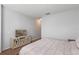 Bright bedroom featuring neutral decor, carpet flooring, and space for a queen-sized bed at 9342 Oglethorpe Dr, Groveland, FL 34736