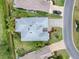 Overhead view of single-Gathering home, showing roof, landscaping, and driveway at 486 Troy Loop, The Villages, FL 32162