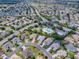 Aerial view of house and surrounding neighborhood at 486 Troy Loop, The Villages, FL 32162