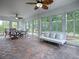 Sunroom with dining area and comfortable seating at 486 Troy Loop, The Villages, FL 32162