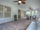 Spacious sunroom with seating and access to the backyard at 486 Troy Loop, The Villages, FL 32162