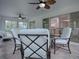 Relaxing sunroom with seating area and ceiling fans at 486 Troy Loop, The Villages, FL 32162