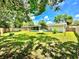 Expansive backyard with lush lawn, privacy fence, and screened-in porch, perfect for outdoor enjoyment at 14598 Sw 34Th Terrace Rd, Ocala, FL 34473