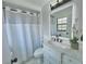 Stylish bathroom featuring a sleek vanity, modern fixtures, and patterned tile flooring at 14598 Sw 34Th Terrace Rd, Ocala, FL 34473