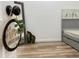 This bedroom features wood-look laminate flooring and tasteful decor at 14598 Sw 34Th Terrace Rd, Ocala, FL 34473