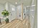 Entryway featuring shiplap and board and batten walls and a front door with decorative glass at 14598 Sw 34Th Terrace Rd, Ocala, FL 34473