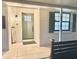 Charming front porch with stylish door and updated exterior lighting at 14598 Sw 34Th Terrace Rd, Ocala, FL 34473