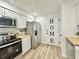 Modern kitchen with stainless steel appliances, white cabinets, butcher block counters, and stylish decor at 14598 Sw 34Th Terrace Rd, Ocala, FL 34473