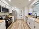 Bright, updated kitchen featuring white cabinets, butcher block countertops, and stainless steel appliances at 14598 Sw 34Th Terrace Rd, Ocala, FL 34473