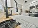Close up of white farmhouse sink with matte black faucet and butcher block countertop at 14598 Sw 34Th Terrace Rd, Ocala, FL 34473
