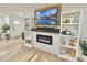 Living room featuring fireplace and built-in shelving at 14598 Sw 34Th Terrace Rd, Ocala, FL 34473
