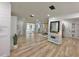 Open-concept living room with wood-look floors and an abundance of natural light at 14598 Sw 34Th Terrace Rd, Ocala, FL 34473