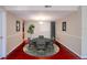 Cozy dining room showcases a round table with seating for four and a stylish rug at 601 W Old Hwy 441 # 11B, Mount Dora, FL 32757