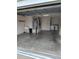 Garage with washer, dryer, and ample storage space at 9215 Se 177Th Simons Ln, The Villages, FL 32162