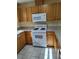 A well-lit kitchen features modern appliances and wood cabinets at 9215 Se 177Th Simons Ln, The Villages, FL 32162