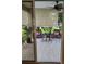 Relaxing screened patio with comfortable seating, perfect for enjoying the outdoor view and fresh air at 9215 Se 177Th Simons Ln, The Villages, FL 32162