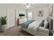 Spacious bedroom with carpeted floors, large window, and plenty of closet space at 5072 Neptune Cir, Oxford, FL 34484