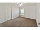 Bright bedroom with carpeted floors and ceiling fan at 5072 Neptune Cir, Oxford, FL 34484