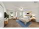 Main bedroom with carpeted floors and stylish staged furniture at 5072 Neptune Cir, Oxford, FL 34484