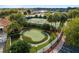 Aerial view of tennis courts and putting green at 5072 Neptune Cir, Oxford, FL 34484