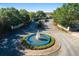 Lakeside Landings community entrance with circular fountain at 5072 Neptune Cir, Oxford, FL 34484