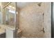 Large walk-in shower with tile surround and built-in bench seat at 5072 Neptune Cir, Oxford, FL 34484