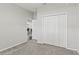 Neutral bedroom features a large closet and doorway to additional living space at 6834 Mossy Oak Ln, Lakeland, FL 33810