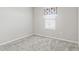 Bedroom with a window and gray colored carpet at 6834 Mossy Oak Ln, Lakeland, FL 33810