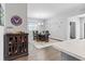 Dining room showcasing an elegant chandelier, stylish decor, and open access to the kitchen area at 6834 Mossy Oak Ln, Lakeland, FL 33810