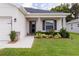 The front entrance is accented with lush landscaping, creating a welcoming entry to the property at 6834 Mossy Oak Ln, Lakeland, FL 33810