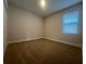 A cozy bedroom with neutral walls, carpeted floor, and a window for natural light at 2252 Juniper Berry Dr, Minneola, FL 34715