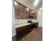 Kitchen features modern stainless appliances, white subway tile backsplash and cabinets at 2252 Juniper Berry Dr, Minneola, FL 34715