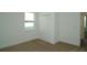 Bedroom featuring neutral carpet, a window with natural light, and a closet at 2311 Juniper Berry Dr, Minneola, FL 34715