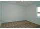 Bedroom with neutral carpet, a window with natural light, and white trim at 2311 Juniper Berry Dr, Minneola, FL 34715