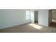 Bedroom featuring new carpet, a window with natural light, a closet, and neutral decor at 2311 Juniper Berry Dr, Minneola, FL 34715