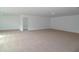 Large, open bonus room featuring neutral carpeting, recessed lighting, and doorway access to other rooms at 2311 Juniper Berry Dr, Minneola, FL 34715