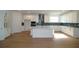 Modern kitchen featuring an island, custom cabinets, and stainless steel appliances at 2311 Juniper Berry Dr, Minneola, FL 34715