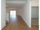 A bright and airy living space with wood floors and neutral walls at 2311 Juniper Berry Dr, Minneola, FL 34715
