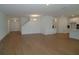 Bright living space featuring wood floors, high ceilings, and access to the kitchen at 2311 Juniper Berry Dr, Minneola, FL 34715