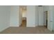 Spacious main bedroom leading to a tiled bathroom with a soaking tub and separate toilet room at 2311 Juniper Berry Dr, Minneola, FL 34715