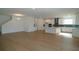 Spacious open-concept living and dining area leading to a modern kitchen at 2311 Juniper Berry Dr, Minneola, FL 34715