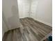 Bedroom with modern wood-look vinyl flooring and painted white doors at 1010 S Grove St, Eustis, FL 32726