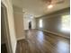 Spacious living room with wood-look flooring and natural light, perfect for entertaining at 1010 S Grove St, Eustis, FL 32726