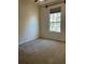 Bedroom with neutral carpeting, window, and a view of the outdoors at 1332 Hunterman Lane, Winter Garden, FL 34787